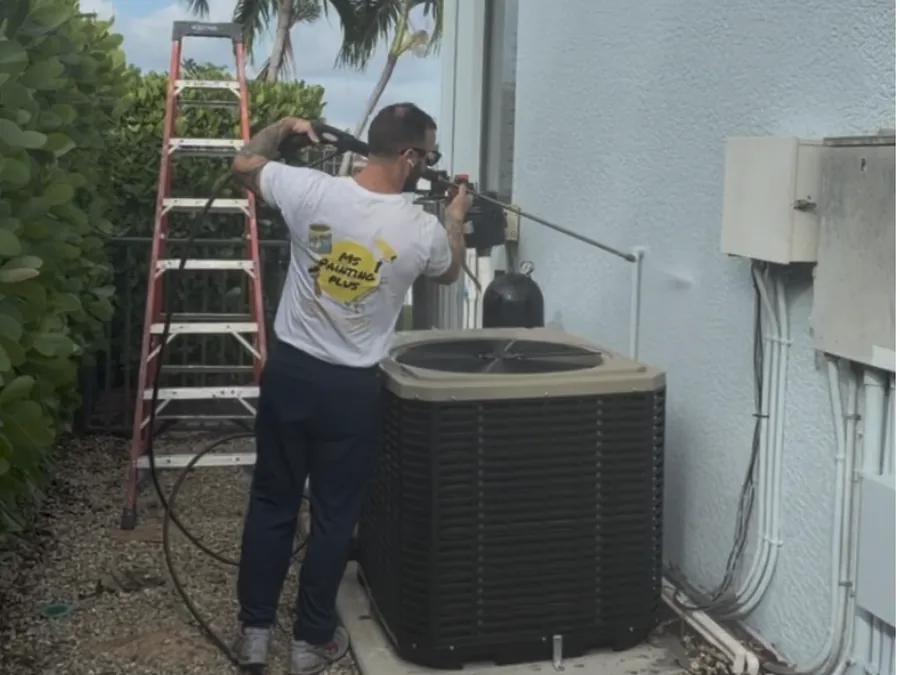 Pressure washing the exterior of a home
