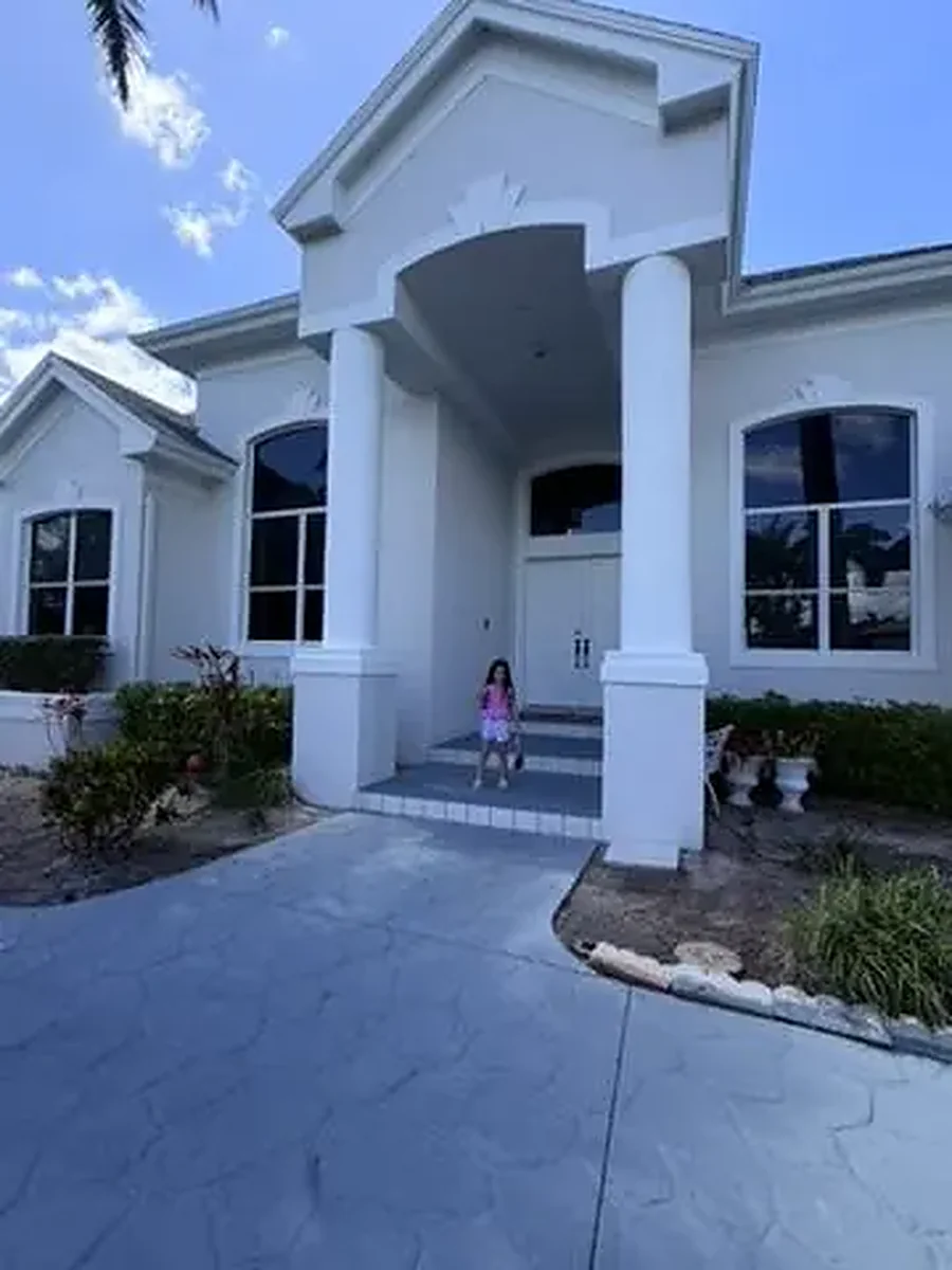 The same home after a full exterior repaint in crisp white